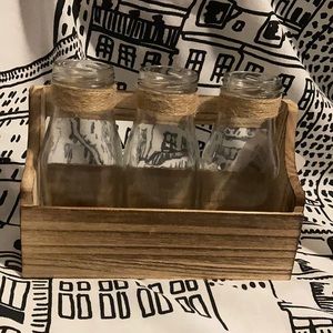 Farmhouse milk bottles in wooden holder